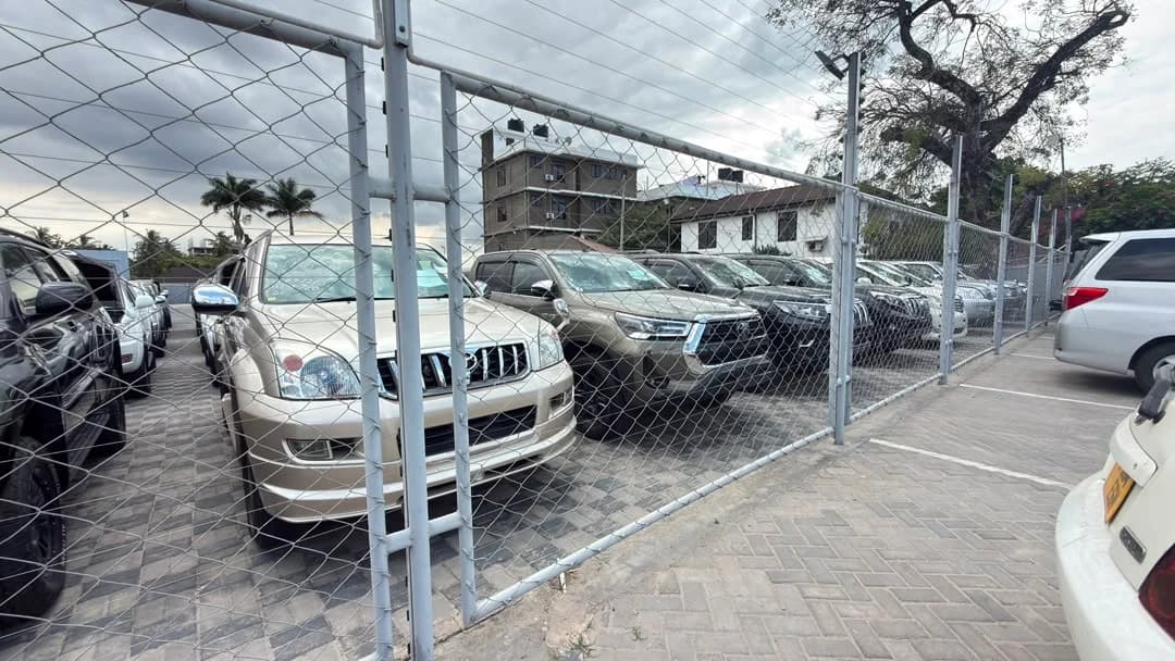Inside the Khushi Motors Tanzania showroom — customer viewing area and vehicle display